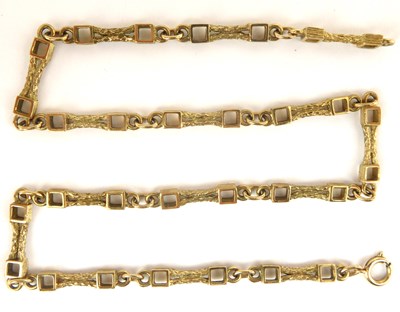 Lot 1162 - A yellow metal contemporary necklace with...