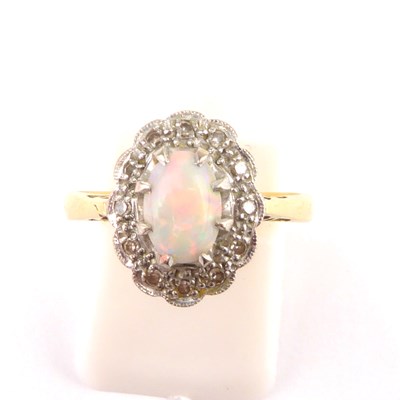 Lot 892 - An 18ct gold opal and diamond ring, the claw...