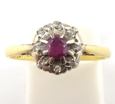 Lot 914 - An 18ct gold platinum and ruby ring, size M,...
