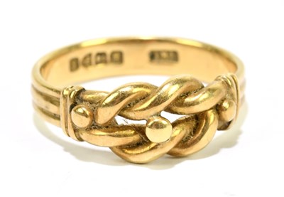 Lot 1094 - An 18ct yellow gold knot ring, size O 1/2,...