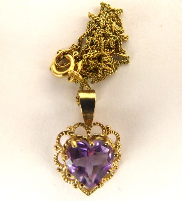 Lot 1115 - A 9ct gold heart-shaped amethyst pendant,...