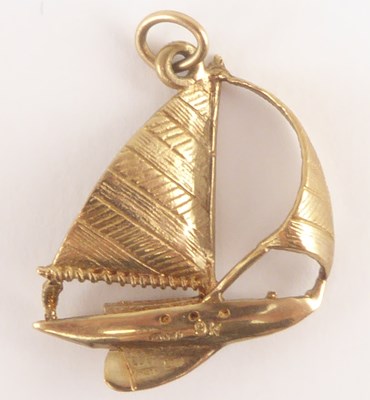 Lot 1107 - A 9ct gold necklace pendant in the form of a...