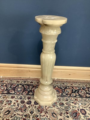 Lot 1522 - A carved alabaster jardinière stand, height 90cm.