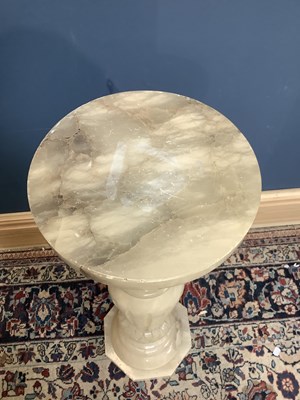 Lot 1522 - A carved alabaster jardinière stand, height 90cm.