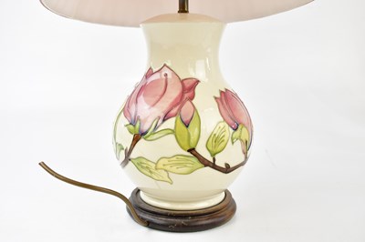 Lot 1414 - MOORCROFT; a graduated pair of lamps and a...