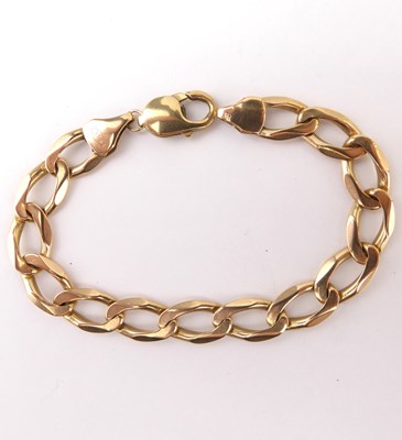 Lot 1033 - A 9ct gold flat link curb bracelet with...