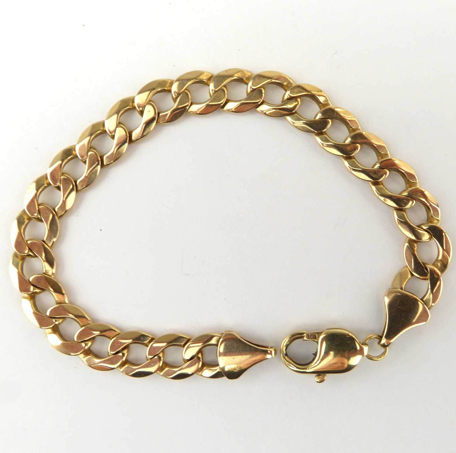 Lot 1036 - A 9ct gold flat curb bracelet, length 20cm,