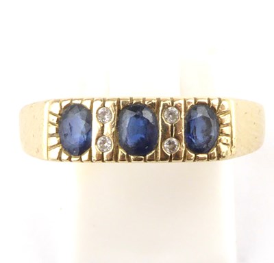 Lot 880 - A 14ct gold ring with three pavé set cut...