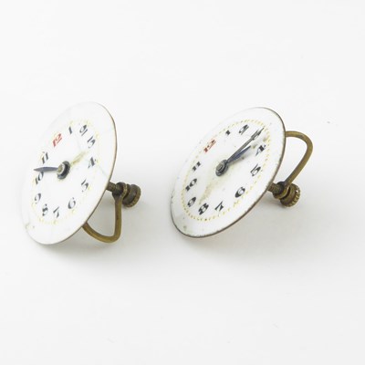 Lot 1185 - An unusual par of earrings, each mounted with...