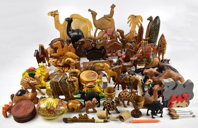 Lot 149 - A collection of wooden camel related items