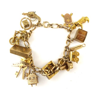 Lot 1049 - A 9ct gold charm bracelet with approximately...