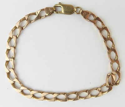 Lot 1035 - A 9ct rose gold flat curb bracelet with...