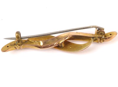 Lot 1065 - A 9ct gold bar brooch with three tiny diamonds...