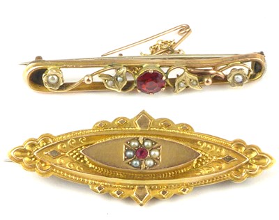 Lot 1067 - Two 9ct gold bar brooches, both set with red...
