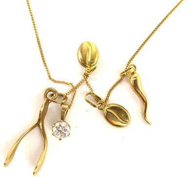 Lot 1105 - A 9ct gold necklace with five gold charms,...