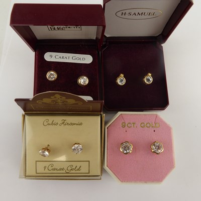 Lot 1191 - Four pairs of boxed 9ct gold earrings, each...