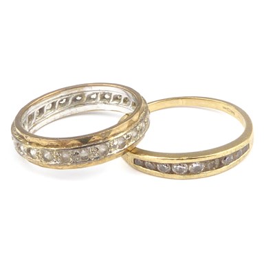 Lot 960 - A 9ct gold half eternity ring set with white...