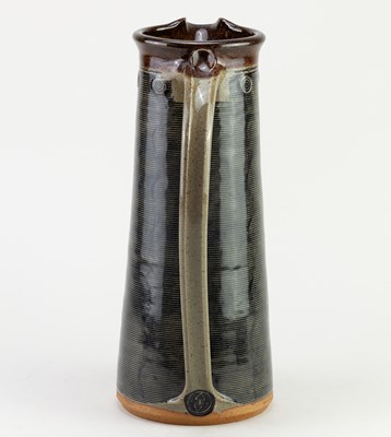 Lot 447 - JENNIE GILBERT; a tall stoneware Mishima jug,...