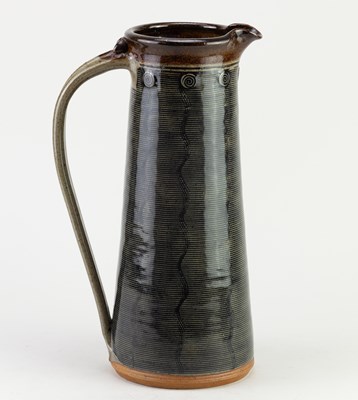Lot 447 - JENNIE GILBERT; a tall stoneware Mishima jug,...