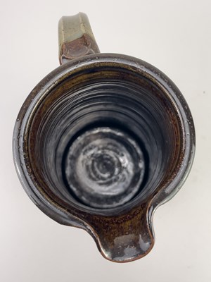 Lot 447 - JENNIE GILBERT; a tall stoneware Mishima jug,...
