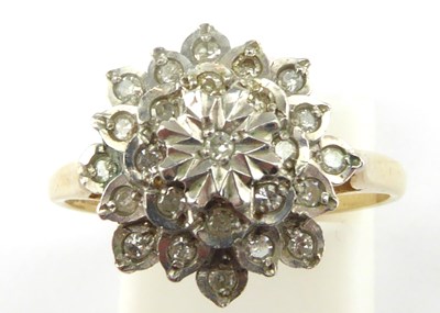 Lot 956 - A 9ct gold diamond cluster ring over three...