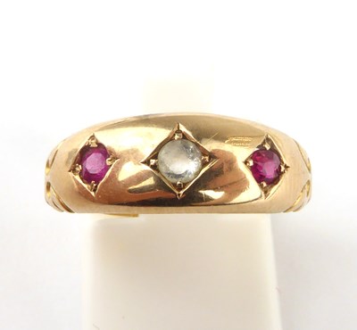 Lot 924 - A 22ct gold ruby and diamond ring, size N,...