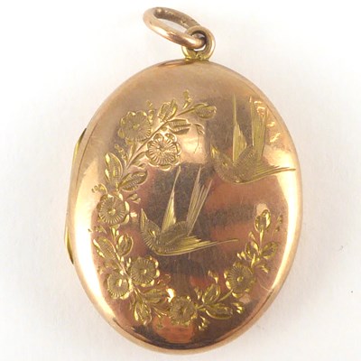 Lot 1110 - A 9ct rose gold oval double locket with floral...