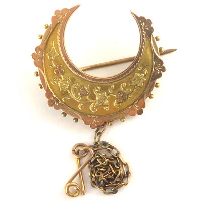 Lot 1063 - A Victorian 9ct rose gold crescent brooch with...