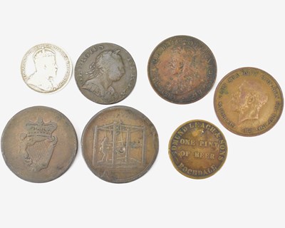 Lot 818 - Seven various tokens and coins to include a...