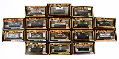 Lot 169 - MAINLINE; sixteen boxed OO gauge wagons, to...