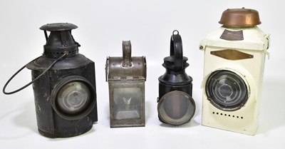 Lot 1056 - Four railway lamps to include the Adlake lamp,...