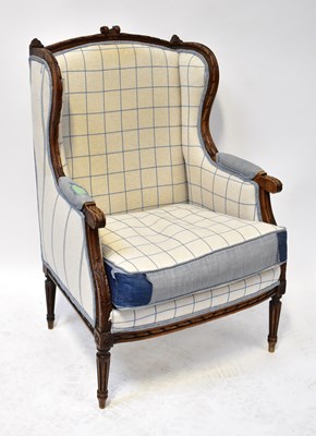 Lot 15 - A 19th century French walnut wing armchair...