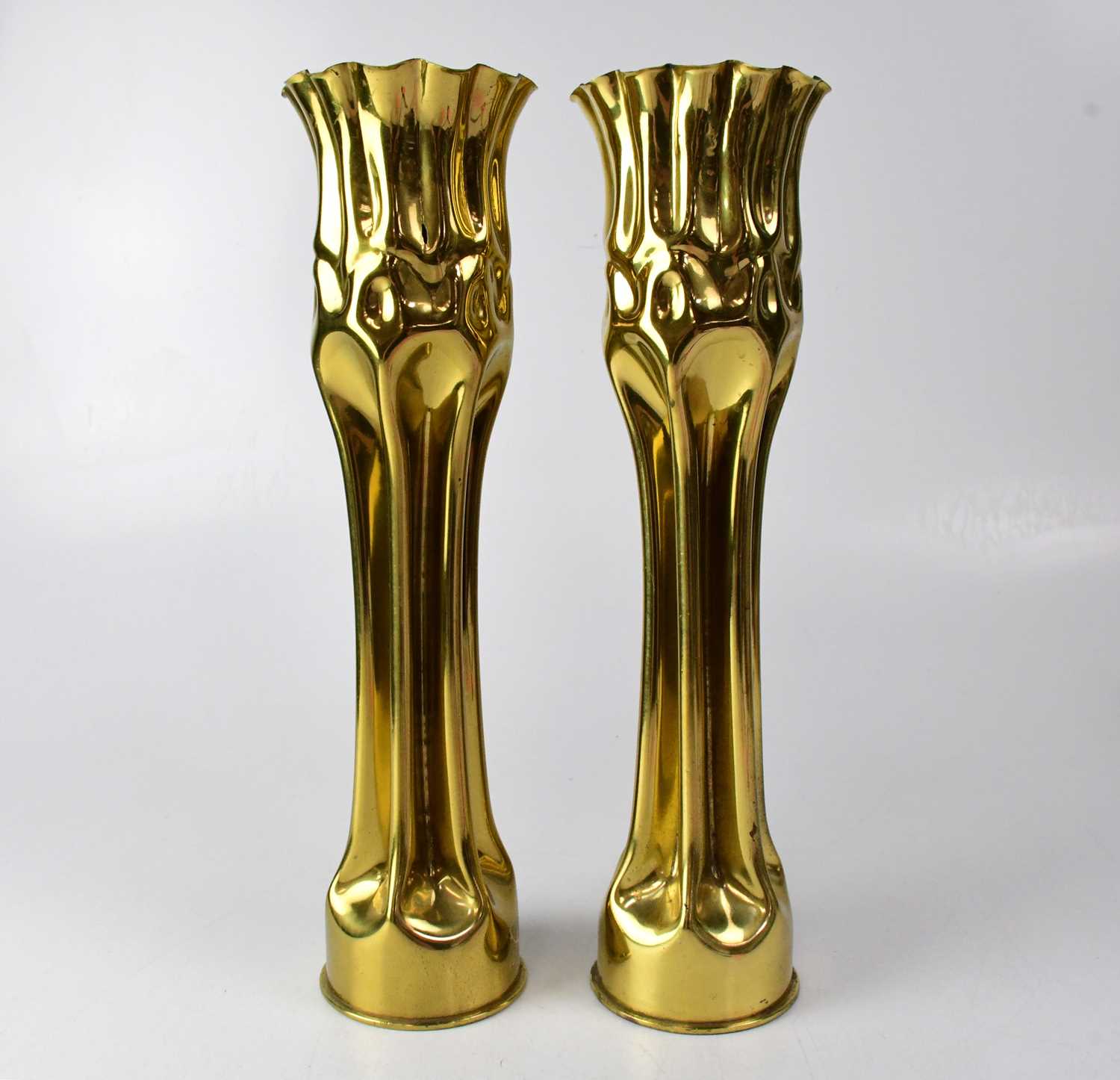 Lot 408 - A pair of shell case 'Trench Art' vases,...