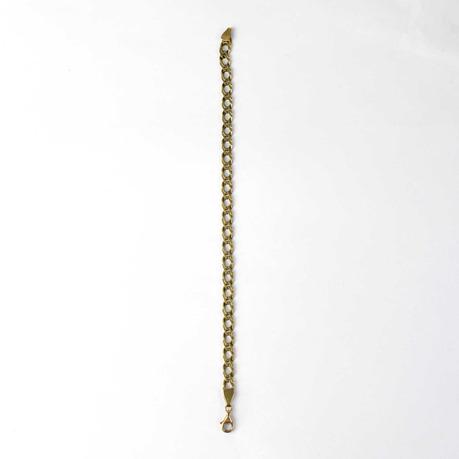 Lot 1040 - A 9ct yellow gold curb link bracelet, length...