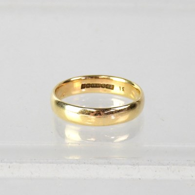 Lot 939 - A 9ct yellow gold wedding band, size R, approx....