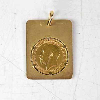 Lot 1091 - A 9ct yellow gold pendant set with a George V...