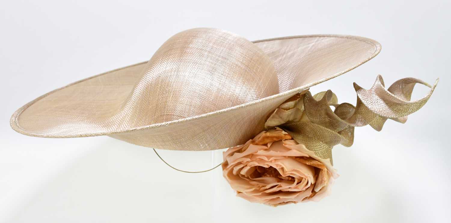 Lot 599 - PHILIP TREACY; a cream asymmetric wide brimmed...