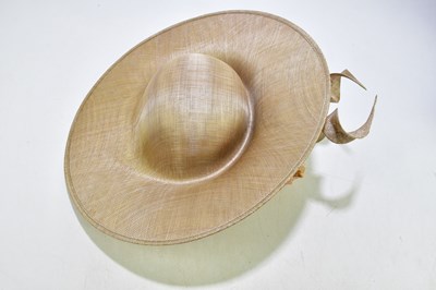 Lot 599 - PHILIP TREACY; a cream asymmetric wide brimmed...