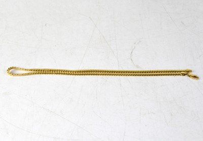 Lot 1161 - A yellow metal flat link chain stamped '750',...