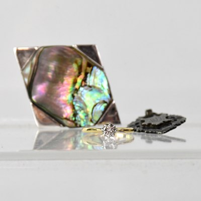 Lot 1218 - A 9ct yellow gold and tiny diamond solitaire...