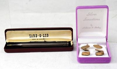 Lot 1200 - A pair of 9ct yellow gold cufflinks with...