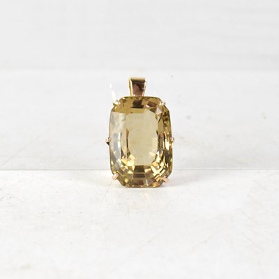 Lot 1128 - A large yellow metal claw set smoky quartz...