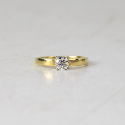 Lot 855 - A 9ct yellow gold diamond solitaire ring, the...