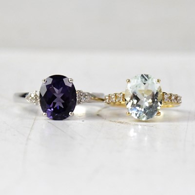 Lot 910 - A 9ct white gold oval iolite and diamond dress...