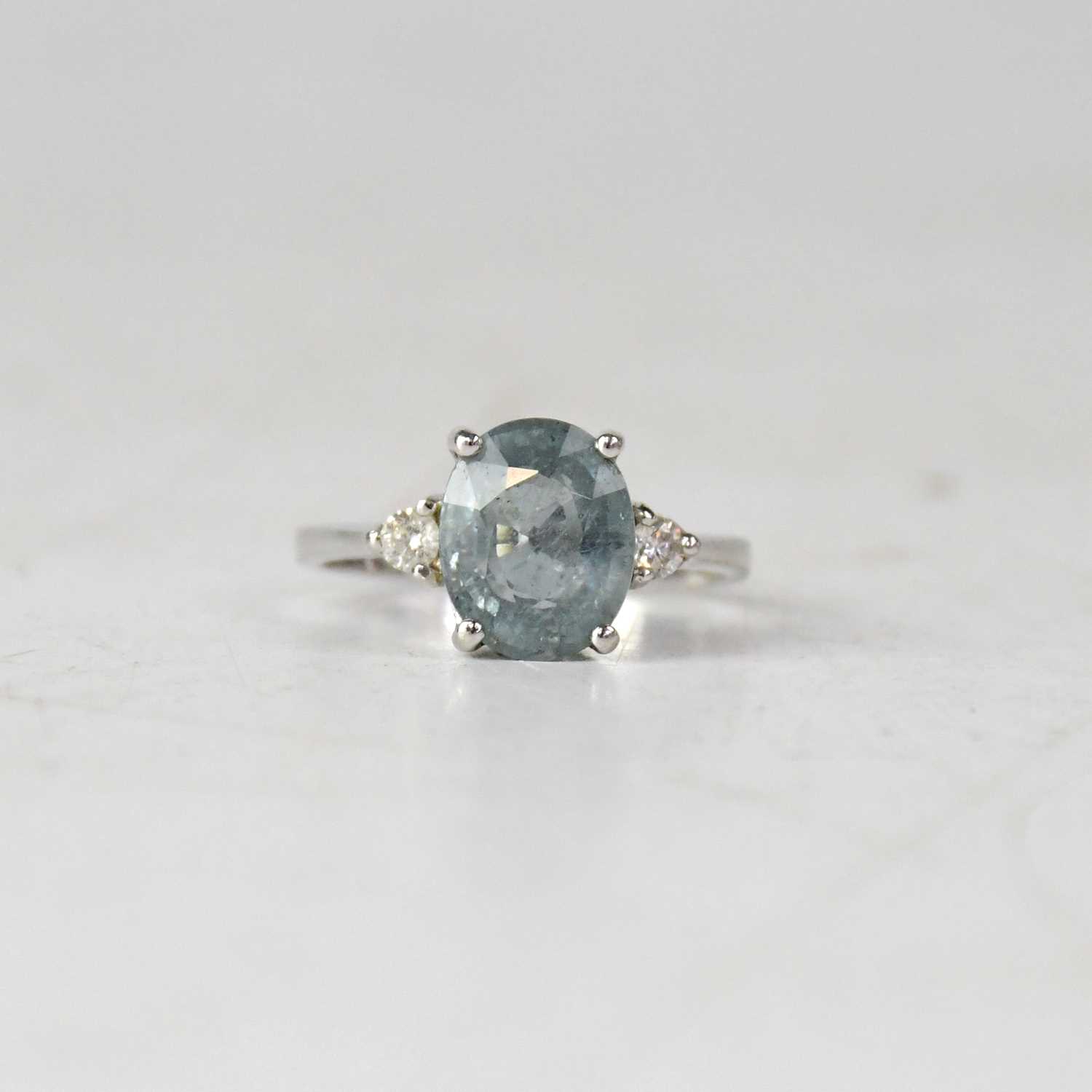 Lot 878 - An 18ct white gold pale blue Paraiba...