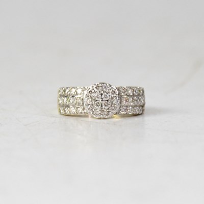 Lot 888 - A 9ct yellow gold three-tiered halo cluster...