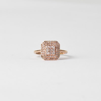 Lot 871 - A 9ct rose gold target cluster design diamond...
