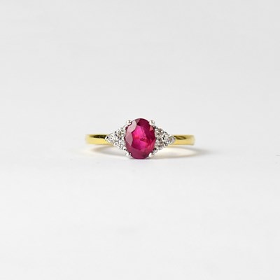 Lot 879 - An 18ct yellow gold ruby and diamond dress...