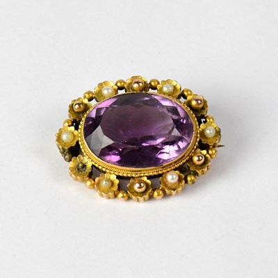 Lot 1071 - A late Victorian yellow metal amethyst oval...