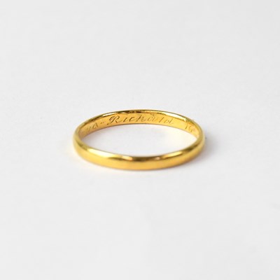 Lot 955 - A 22ct yellow gold wedding band, size M1/2,...